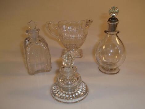 A 19thC cut glass scent bottle of square shouldered form with panel sides