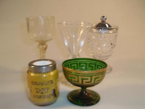 A Murano type wine glass with a moulded circular bowl over baluster stem flecked with gold