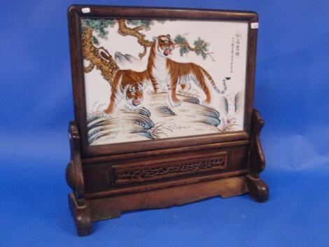 A Chinese painted porcelain table screen