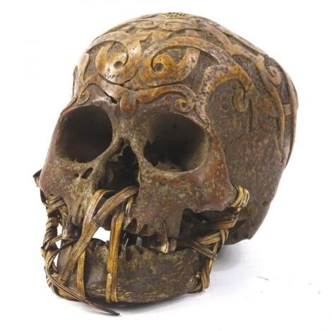 A hand carved tribal skull