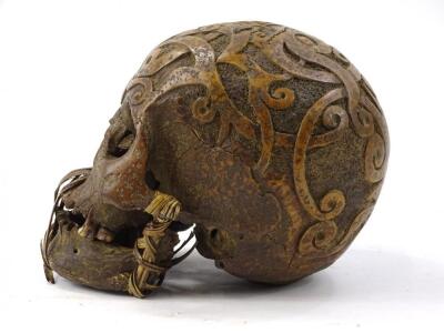 A hand carved tribal skull - 3