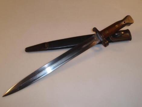 A military bayonet with a double edge steel blade marked Wilkinson