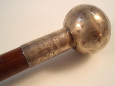 A military baton with silver handle inscribed "From the Governor-General of Freedom"