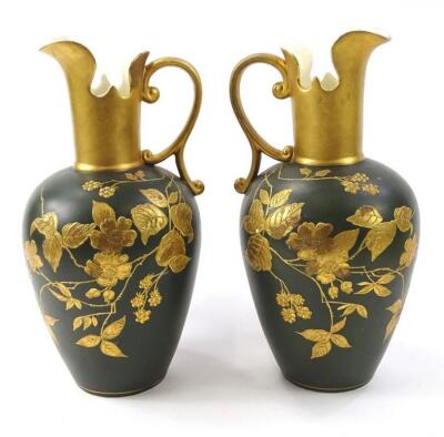A pair of 19thC pottery ewers