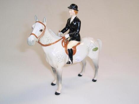 A Beswick figure of a rider and horse stood still