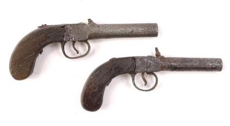 A matched pair of reproduction muff style pistols