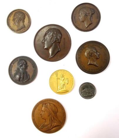 A collection of bronze portrait medallions