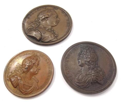 Three bronze medallions