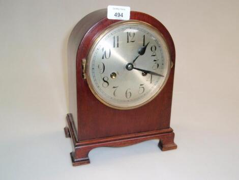 A mantel clock of 8-day movement striking on a gong the silver dial with