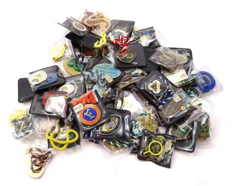 A quantity of horse racing members badges