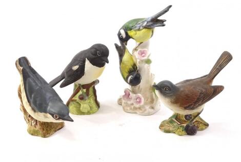 Four ceramic birds