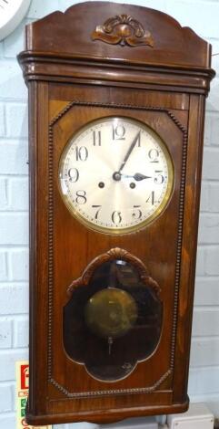 An early 20thC mahogany cased wall clock