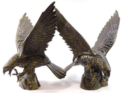 A pair of late 20thC/early 21stC gilt cast metal models of eagles