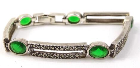 A marcasite and green coloured paste bracelet