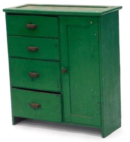 A green painted tool cabinet