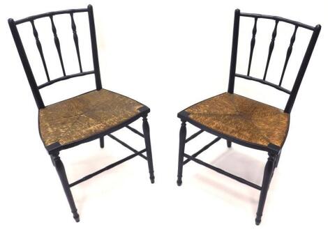 A pair of William Morris Sussex type ebonised side chairs