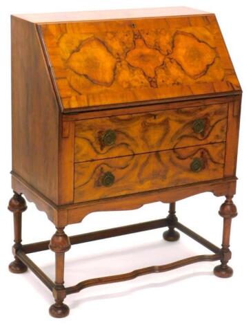 A figured walnut bureau