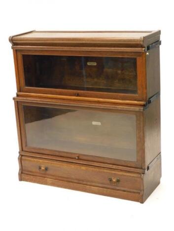 A Globe Wernicke oak two tier barristers bookcase