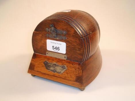 A 1930s oak cigarette box with Swiss music box base