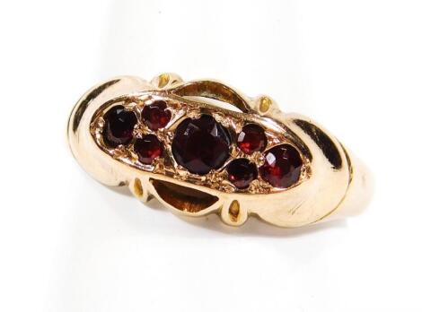 A ladies 9ct gold garnet dress ring