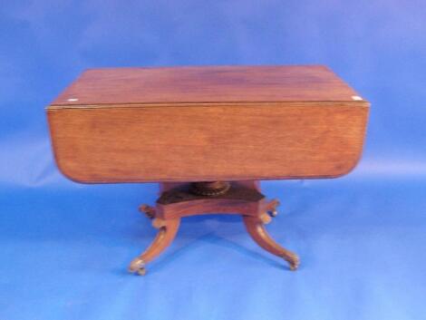 A Regency mahogany Pembroke table on four sabre legs