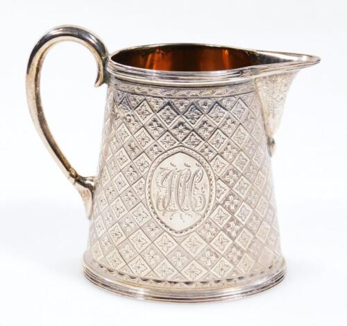 A Victorian silver and silver gilt cream jug