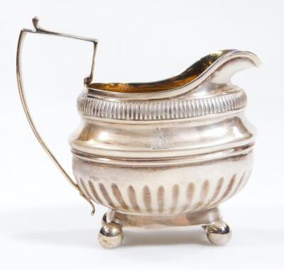 A George III silver and silver gilt cream jug