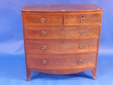 A Regency flamed mahogany bow front chest of two short and three long graduated