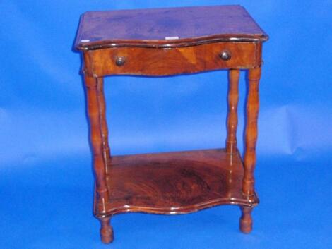 A Victorian and later walnut Serpentine whatnot with drawer