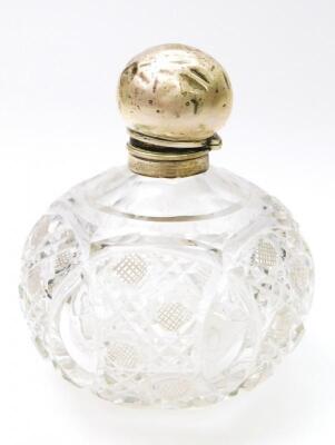 An Edwardian silver and cut glass dressing table perfume bottle