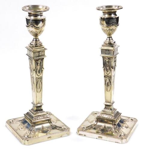 A pair of silver plated Adam design Neo-Classical candlesticks
