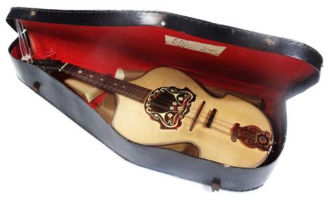 An early 20thC Italian rosewood tortoiseshell finish mandolin