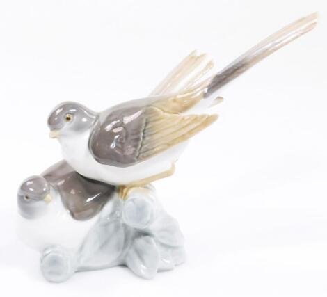 A 20thC Lladro figure group of two birds