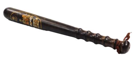 An early 20thC truncheon with shaped handle