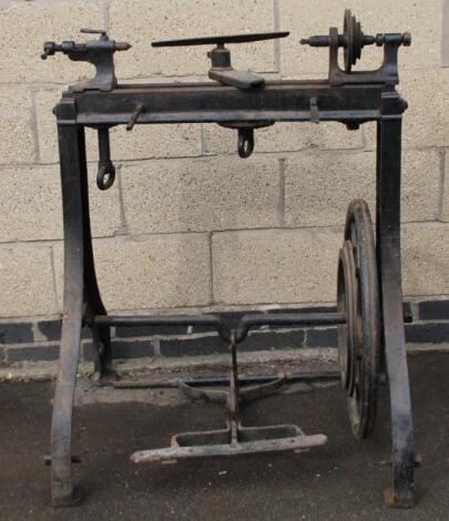 An early 20thC cast metal industrial lathe