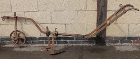 A 19thC cast metal furrow plough