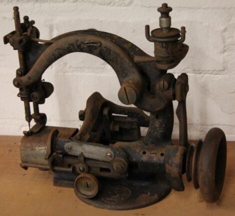 A late 19thC shaped sewing machine with angular top