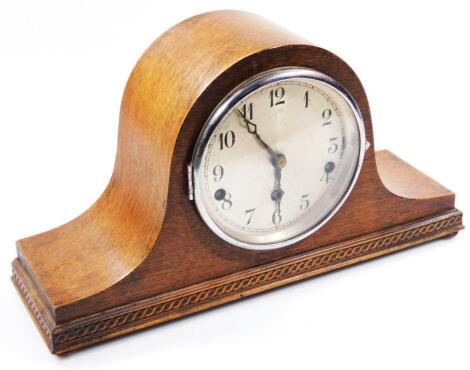 An early 20thC oak Napoleon Hat mantel clock