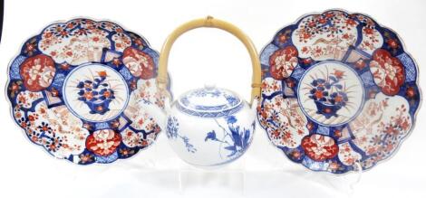 A matched pair of Japanese Imari plates