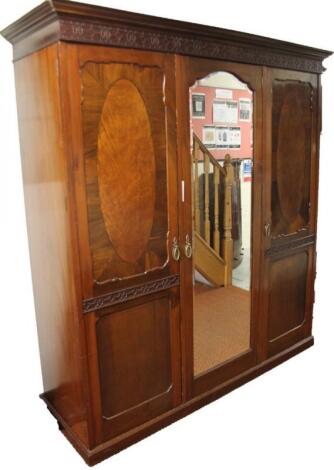 A late 19thC mahogany and walnut triple wardrobe