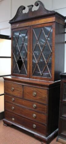 A George III mahogany and satinwood inlaid secretaire bookcase