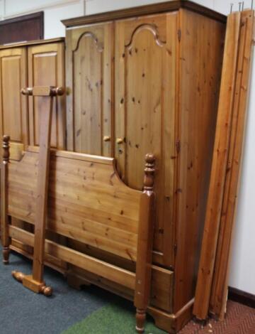 A stripped and lightly polished pine double door wardrobe