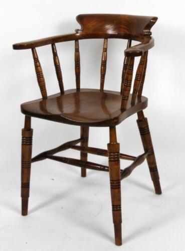 An early 20thC ash and elm captain's chair