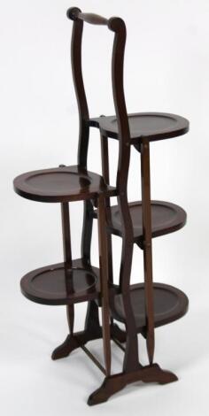 An early 20thC mahogany and part inlaid folding cake stand