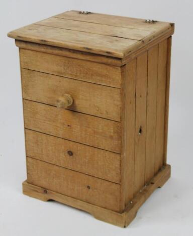 An early 20thC pine cupboard