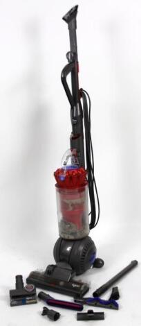 A Dyson DC55 upright electric vacuum cleaner with accessories