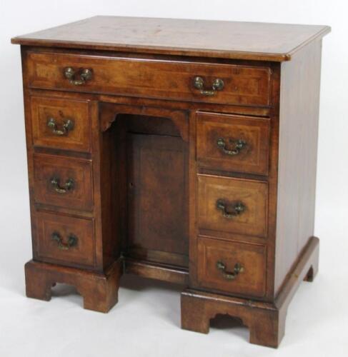 A 18thC walnut kneehole desk