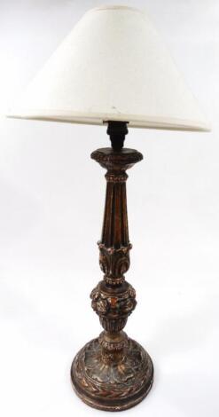 A 20thC carved giltwood table lamp