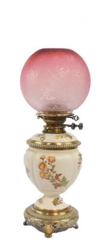 A Royal Worcester blush porcelain and brass oil lamp