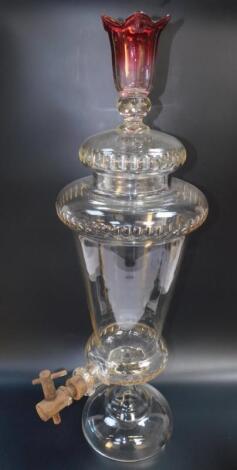 A Victorian cut glass spirit dispenser and cover